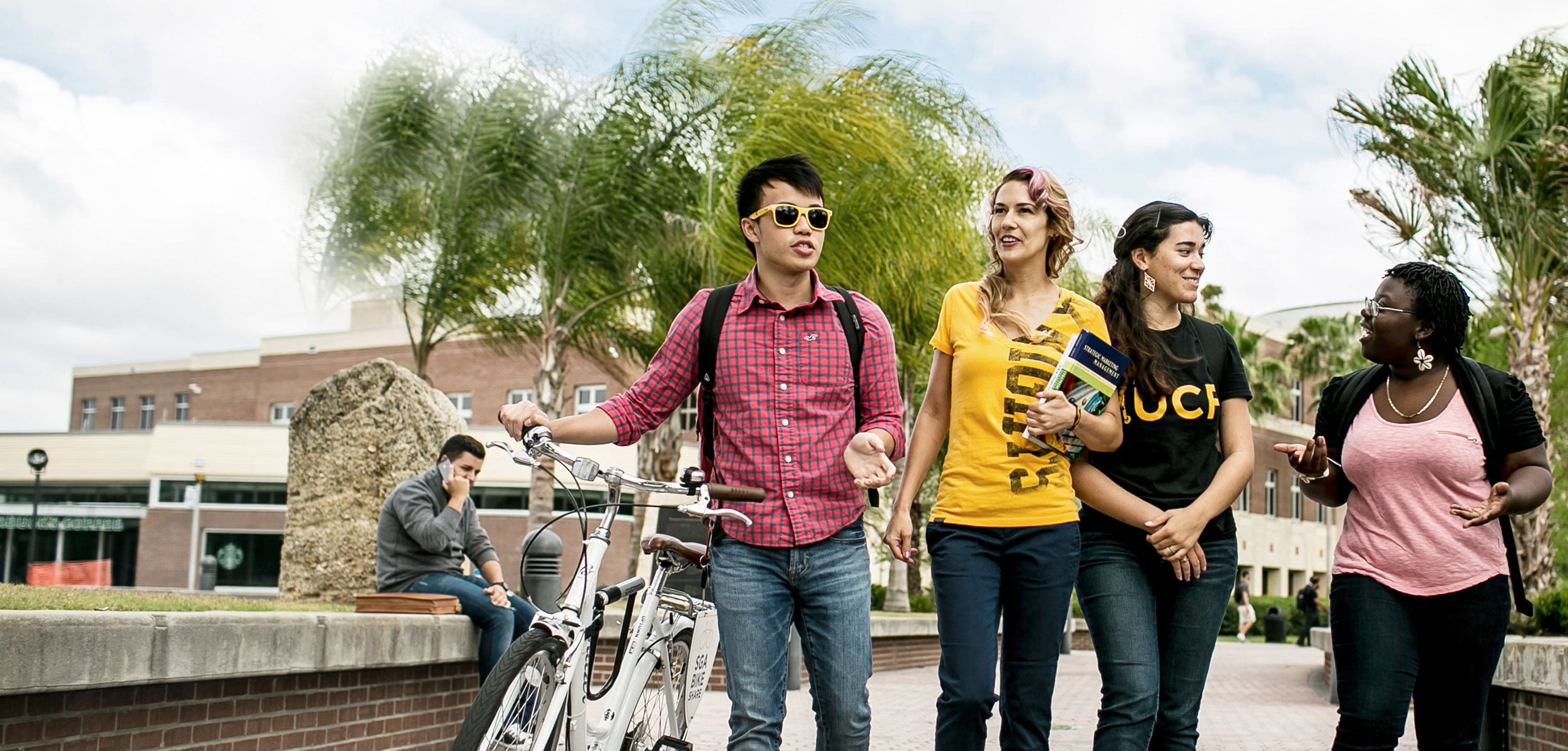 Students on campus walking and having a conversation