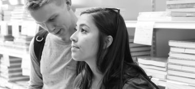 A boy and a girl in a books store