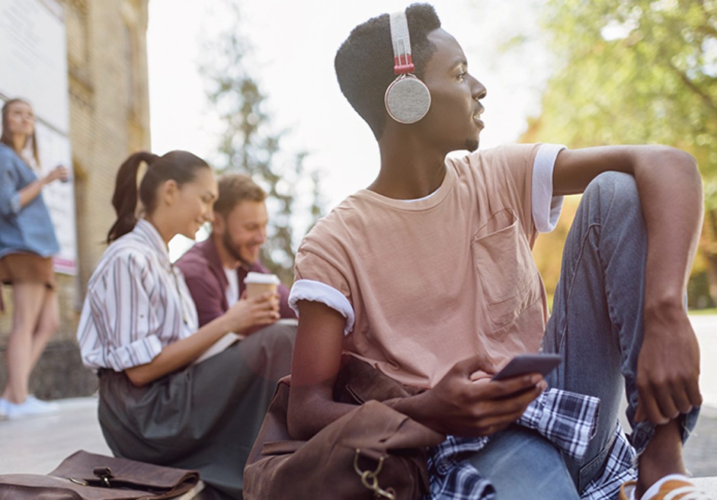 Students hanging out at a campus bookstore, drinking coffee and listening to music