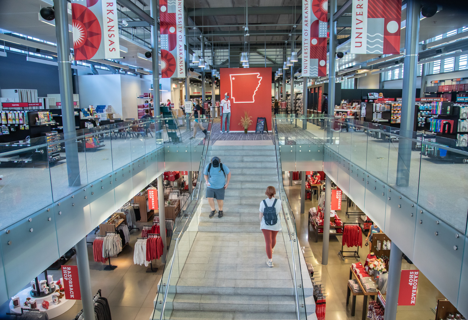 Students climbing staircases inside a Collegiate Retail illustration