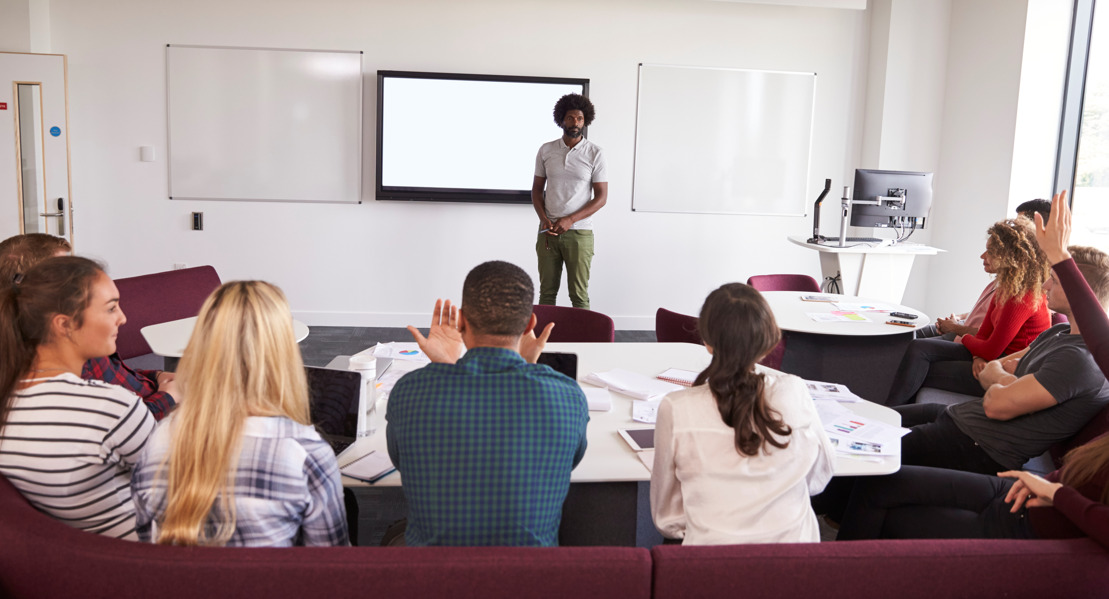 A student speaking before so many students sitting in a classroom