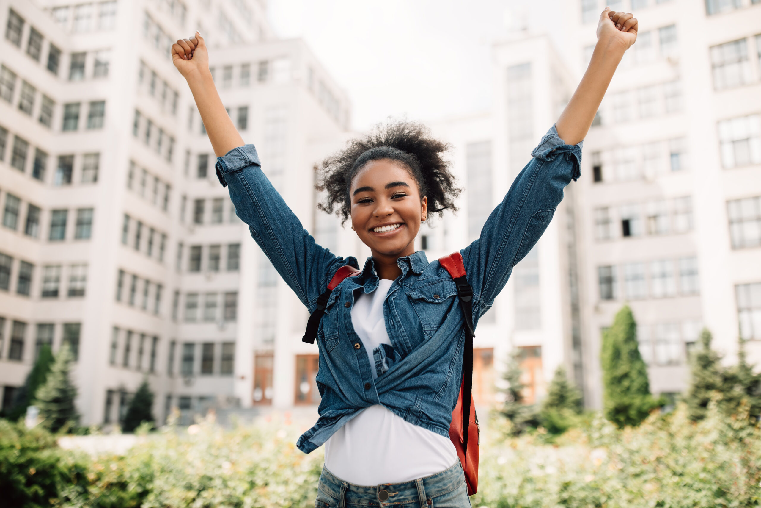 Girl Student shaking fists celebrating her success