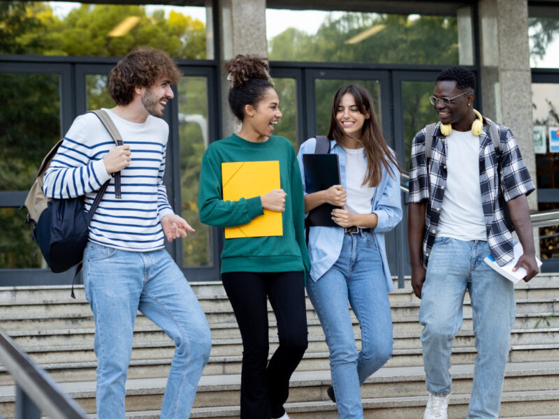 group of diverse college students talking to each